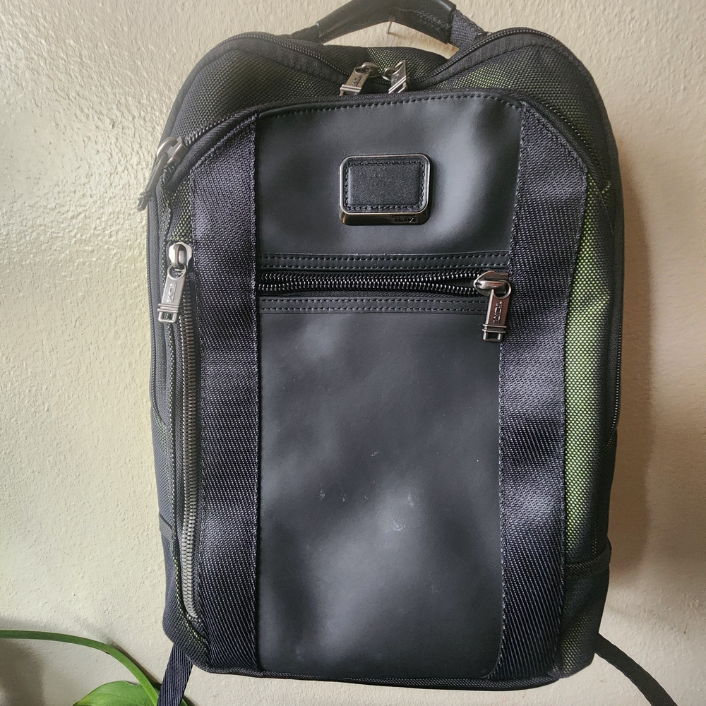 Tumi Black and Green Backpacks with Structured Design